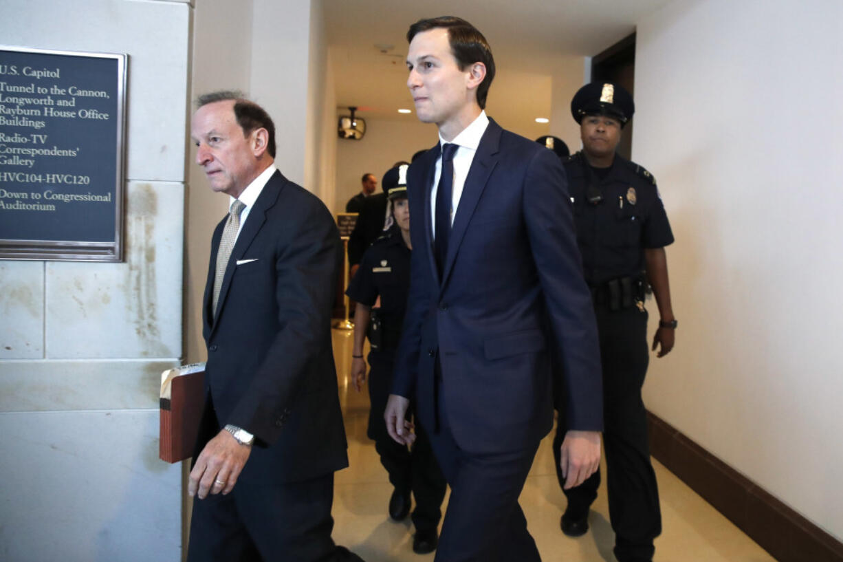 White House adviser Jared Kushner, center, and his attorney Abbe Lowell, left, arrive on Capitol Hill in Washington on Tuesday to be interviewed behind closed doors by the House Intelligence Committee.