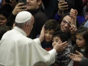 Pope Francis greets children from the Vatican’s Bambino Gesu Pediatric Hospital. During the audience in the Vatican’s Paul VI hall, Francis exhorted hospital caregivers not to fall prey to corruption, which he called the “greatest cancer” that can strike a hospital.