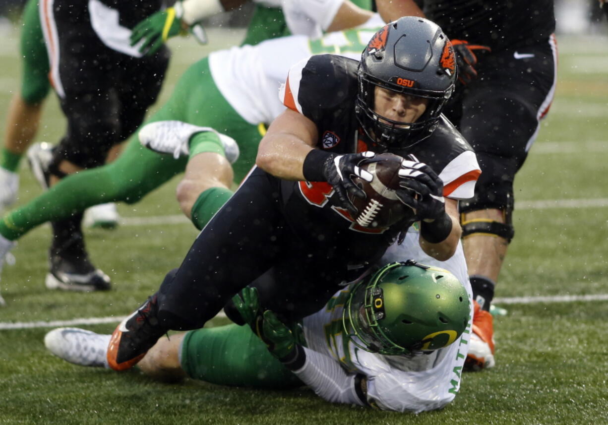 Oregon State running back Ryan Nall scored four times against Oregon in the season finale last season. That 34-24 victory is still fueling the Beavers as they prepare to open fall camp. (AP Photo/Timothy J.