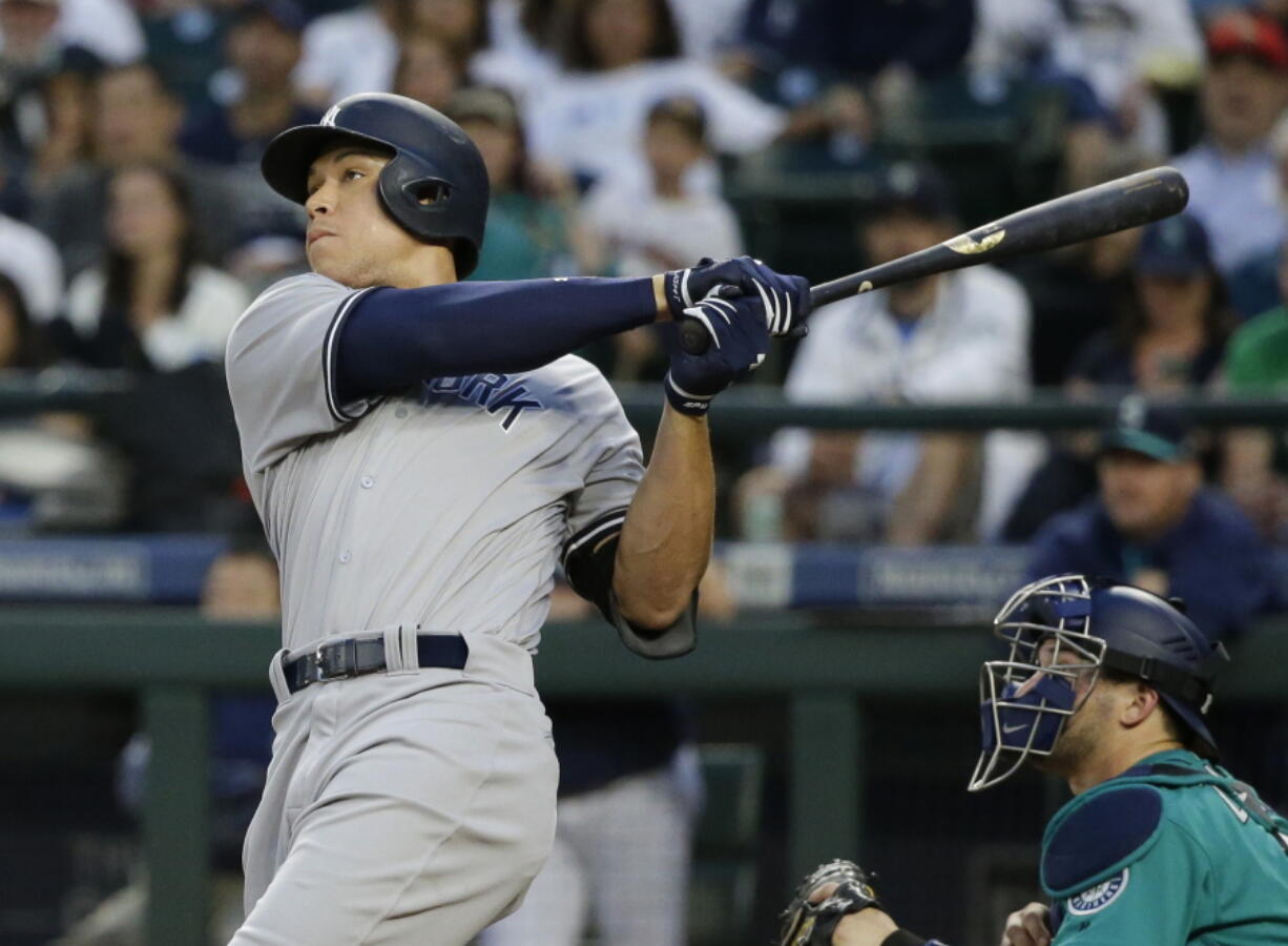 New York Yankees’ Aaron Judge watches his three-run home run against the Seattle Mariner during the fifth inning of a baseball game Friday, July 21, 2017, in Seattle. (AP Photo/Ted S.