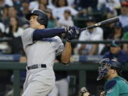 New York Yankees’ Aaron Judge watches his three-run home run against the Seattle Mariner during the fifth inning of a baseball game Friday, July 21, 2017, in Seattle. (AP Photo/Ted S.