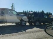 Two vehicles involved involved in a three-automobile, single-motorcycle fatal crash Tuesday afternoon are pictured in this photo from the Washington State Patrol. The crash killed the motorcycle rider and blocked traffic on Interstate 205 heading north.