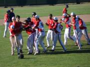 The Camas-Washougal Babe Ruth team celebrates during the 13-15 year old Pacific Northwest Regional tournament last week in Kelso.