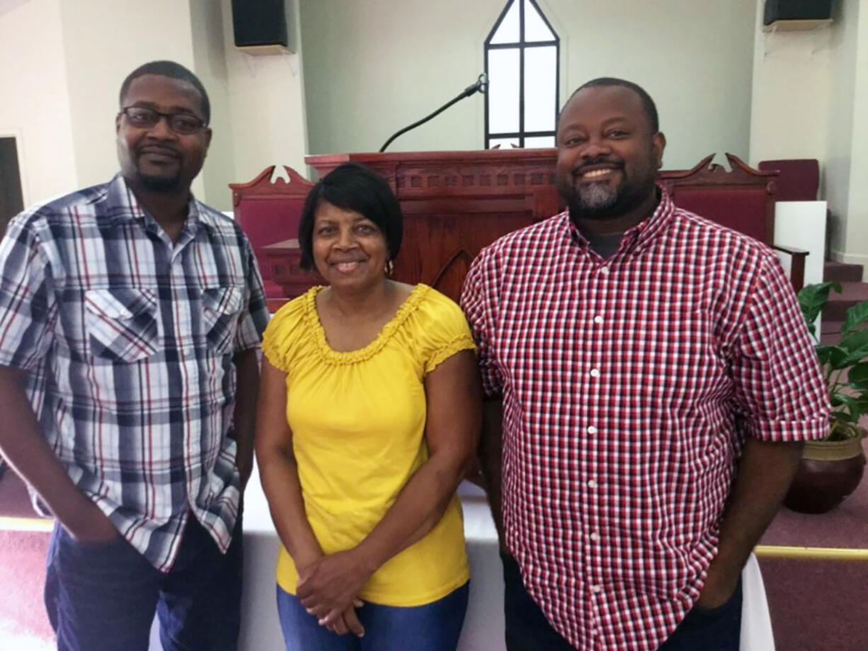 Mary Jo Snead’s sons Carlos, left, and Ernest took after their father and became pastors of two Georgia churches.