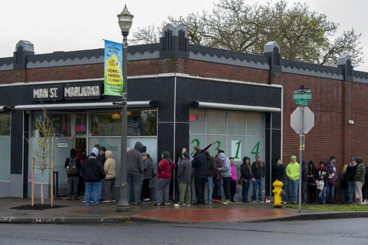 A line of customers wait to enter Main Street Marijuana’s Uptown Village store during their 420 Sale on April 20, a date famous among marijuana users. Co-owner Ramsey Hamide said they are looking to relocate to a shop with better parking.