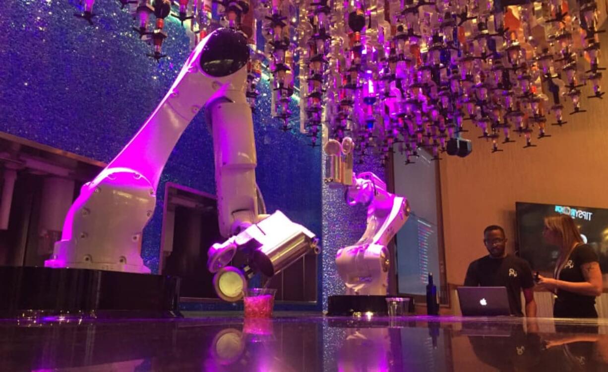 Robots serve drinks at The Tipsy Robot, which opened inside the Miracle Mile Shops next to Planet Hollywood Casino in Las Vegas.