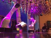 Robots serve drinks at The Tipsy Robot, which opened inside the Miracle Mile Shops next to Planet Hollywood Casino in Las Vegas.