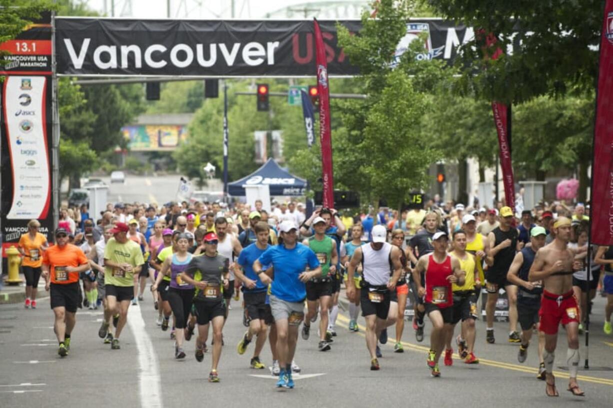 Runners leave the starting line for the Vancouver USA Marathon in downtown Vancouver.