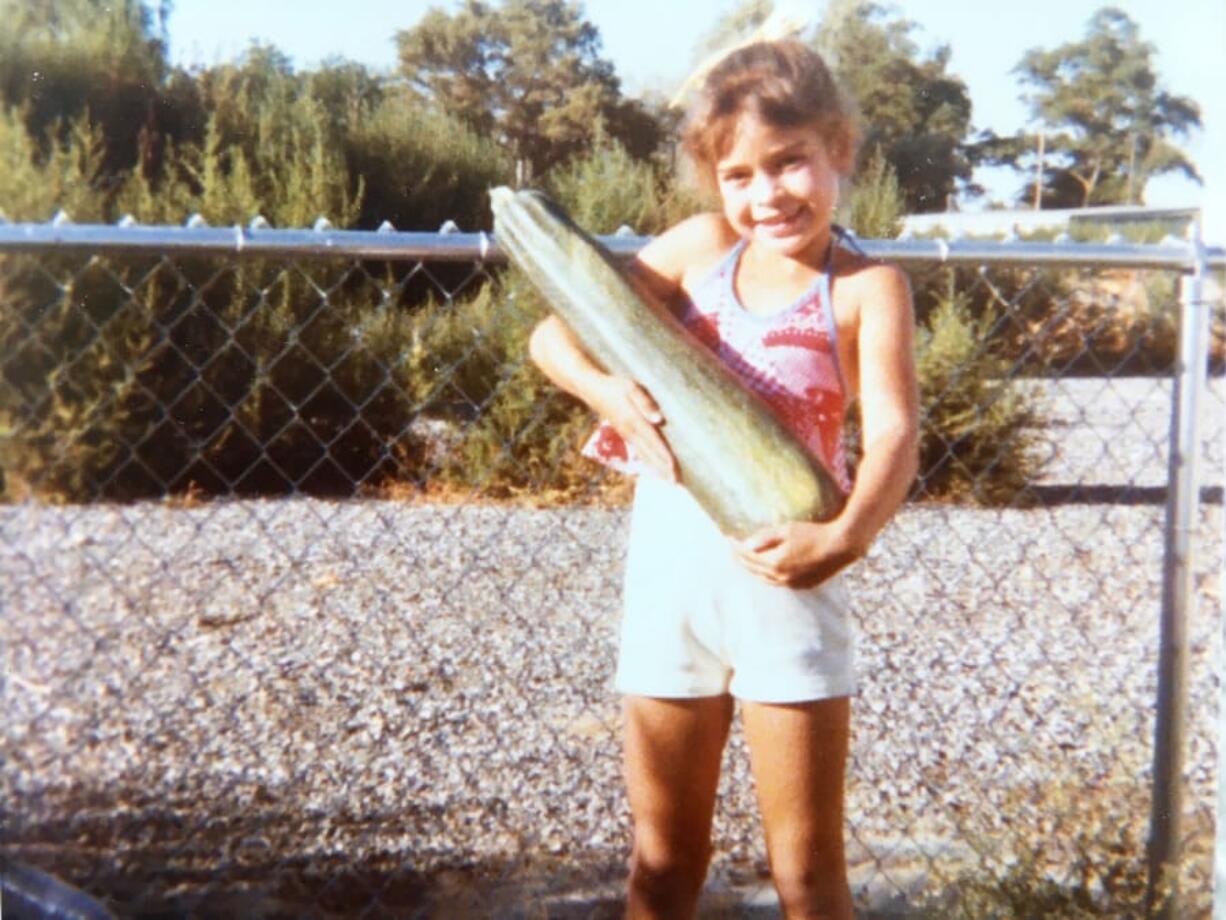 Lucy Luginbill’s daughter, Tiffany, strikes a pose in the summer of 1978 with the zucchini that arrived at the right time.