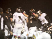 Battle Ground's Noah Barr (50) celebrates after a touchdown in the first quarter at Battle Ground High School on Friday night, Oct. 7, 2016.