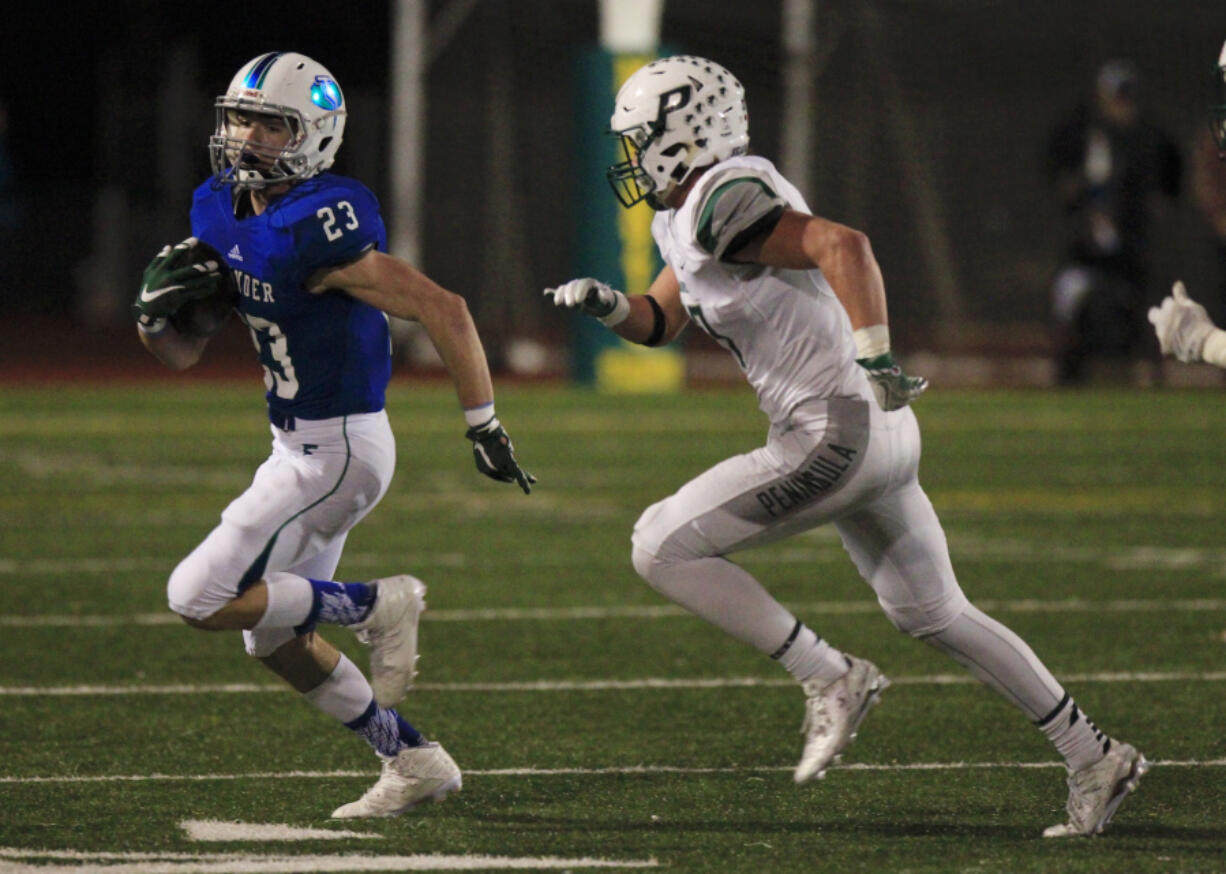 Glen Perry, Jr., left, moves to quarterback after rushing for more than 800 yards and seven touchdowns last season.(Steve Dipaola for the Columbian)