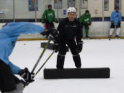 Vancouver native Austin Coldwell instructs players as they run through drills during the ACPHOCKEY summer camp at Mountain View Ice Arena in Vancouver on Friday morning, August 18, 2017.