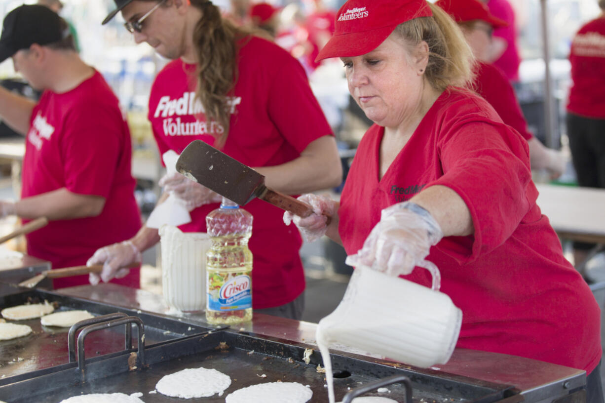 Lory Cato prepares pancakes for the Clark County Fair in Ridgefield on Friday morning. This is Lory’s fifth year cooking at the fair, which will run this year from Aug. 4-13 at the Clark County Event Center at the Fairgrounds.