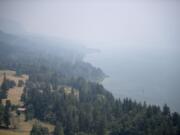 A thick haze obstructs the scenic view of the Columbia River Gorge from the Highway 14 Cape Horn overlook east of Washougal on Wednesday afternoon, Aug. 2, 2017.