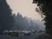 Drivers traveling along Highway 14 navigate smoky conditions during their commute while near the Lieser Road exit Thursday morning. Smoke from Canadian and Oregon wildfires combined with stagnant air conditions throughout the region are leading to thick haze in the Vancouver area.