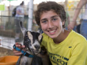 Fourteen-year-old Steven Schmidt of Battle Ground and Twilight, who produced some of the milk for his mozzarella cheese that earned a blue ribbon Saturday in the dairy goat cheese competition at the Clark County Fair. (Randy L.