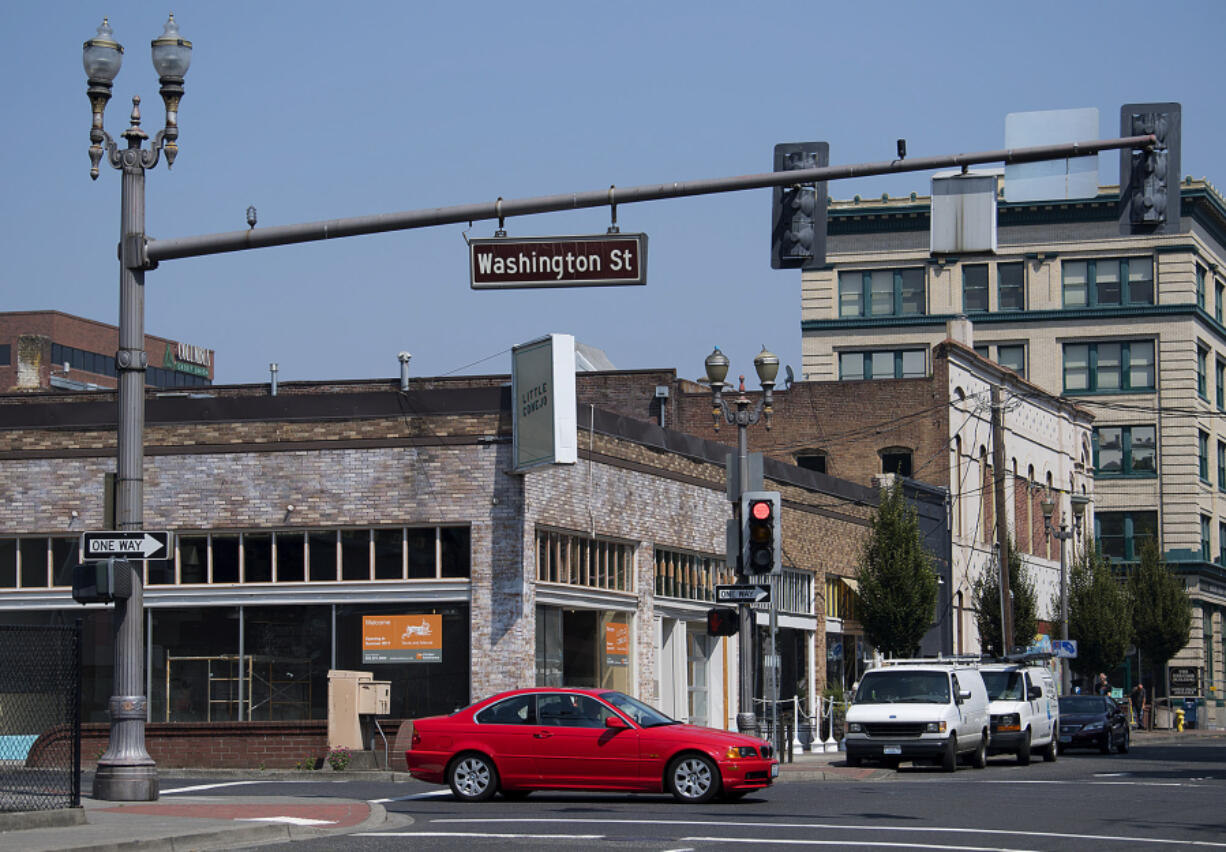 A motorist passes the location of a new restaurant, Little Conejo, under construction in the Schofield Building. The building has undergone a face-lift the last two years, with the help of the city, to bring in new tenants.