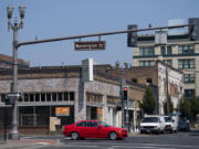 A motorist passes the location of a new restaurant, Little Conejo, under construction in the Schofield Building. The building has undergone a face-lift the last two years, with the help of the city, to bring in new tenants.