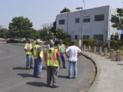 Port of Vancouver officials inspect property on Columbia Way where construction of a new hotel is proposed. Port commissioners voted 3 to 0 Tuesday to sign a 50-year lease and build a hotel at the waterfront.