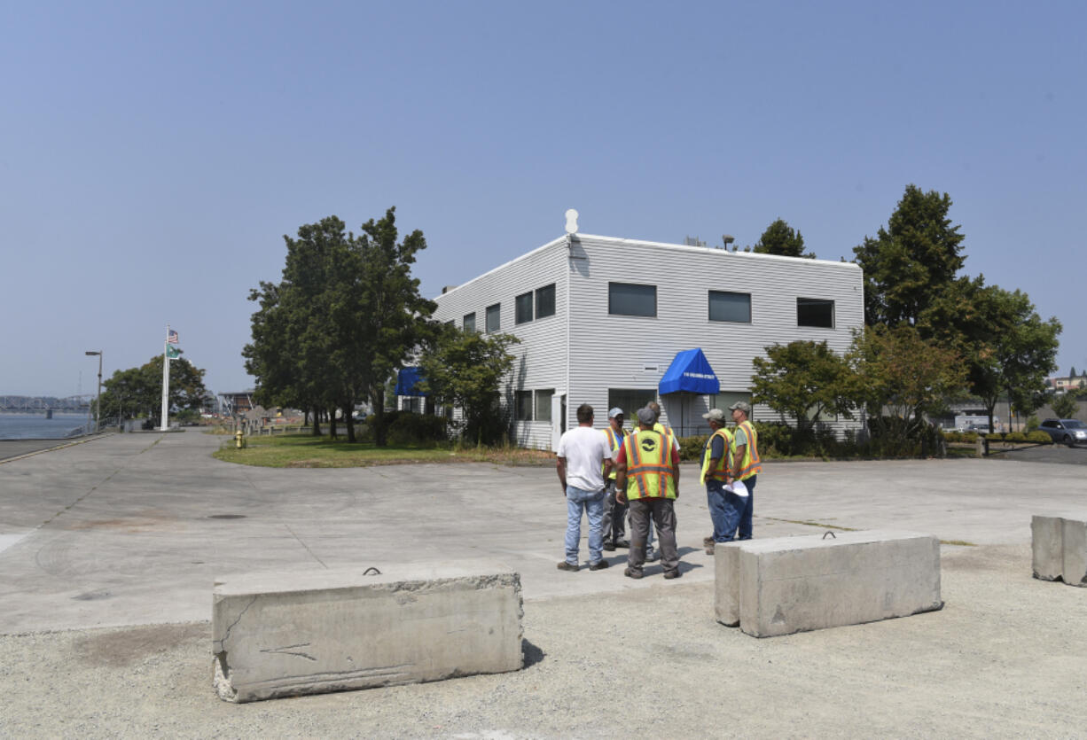 Port of Vancouver officials inspect property on Columbia Way where construction of a new hotel is proposed. The hotel isn’t expected to break ground until next summer at the earliest, officials said.