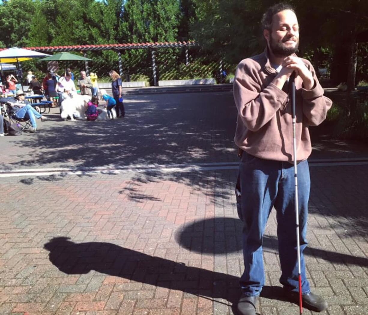 John Furniss, who is blind, did his best to take in the solar eclipse in downtown Washougal on Aug. 21. And many sighted friends did their best to describe the experience for him.