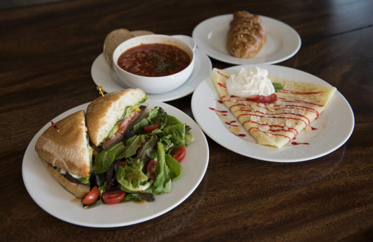 The roast beef ciabatta sandwich, borscht soup, smoked salmon and cream cheese piroshki and strawberries and cream crepe at Main Street Cafe in Battle Ground.