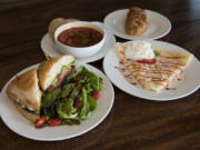 The roast beef ciabatta sandwich, borscht soup, smoked salmon and cream cheese piroshki and strawberries and cream crepe at Main Street Cafe in Battle Ground.