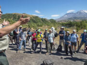 At a stop on the Hummocks Trail, Peter Frenzen, Forest Service scientist at Mount St. Helens, gives an overview of the rebirth of the volcano to a group of international geologists.