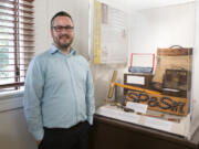 Executive Director Brad Richardson stands in front of an exhibit on the old Spokane, Portland and Seattle Railway in the Clark County Historical Museum.