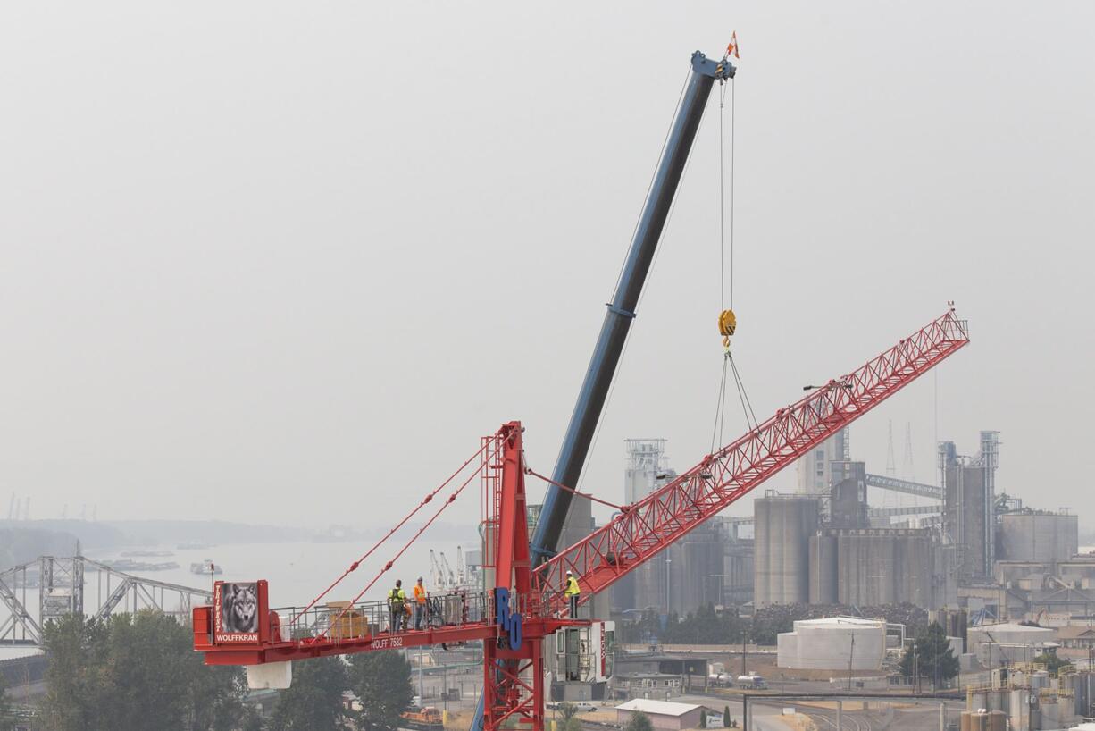 Construction continues on the waterfront as a second crane pops up Tuesday afternoon. The crane was expected to be finished later in the day and tested Wednesday.