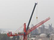 Construction continues on the waterfront as a second crane pops up Tuesday afternoon. The crane was expected to be finished later in the day and tested Wednesday.