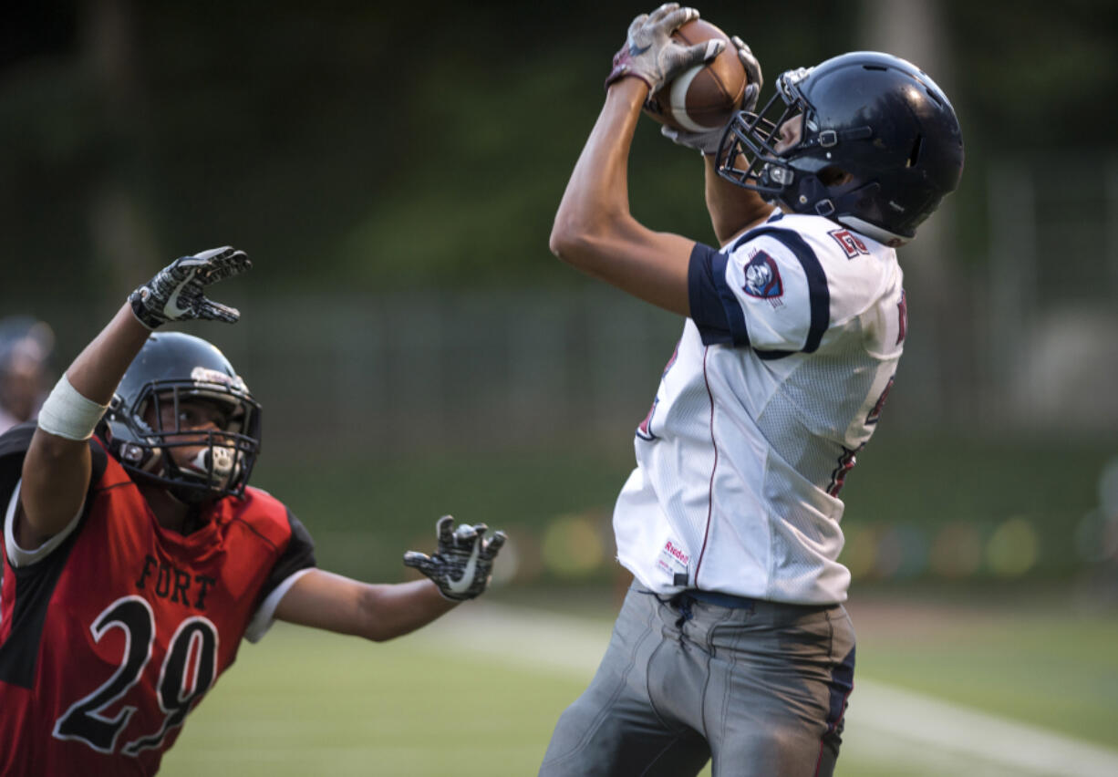 Michael Garrison (2) of King’s Way Christian pulls in the first of his three touchdown receptions in the Knights’ 56-0 win over Fort Vancouver.