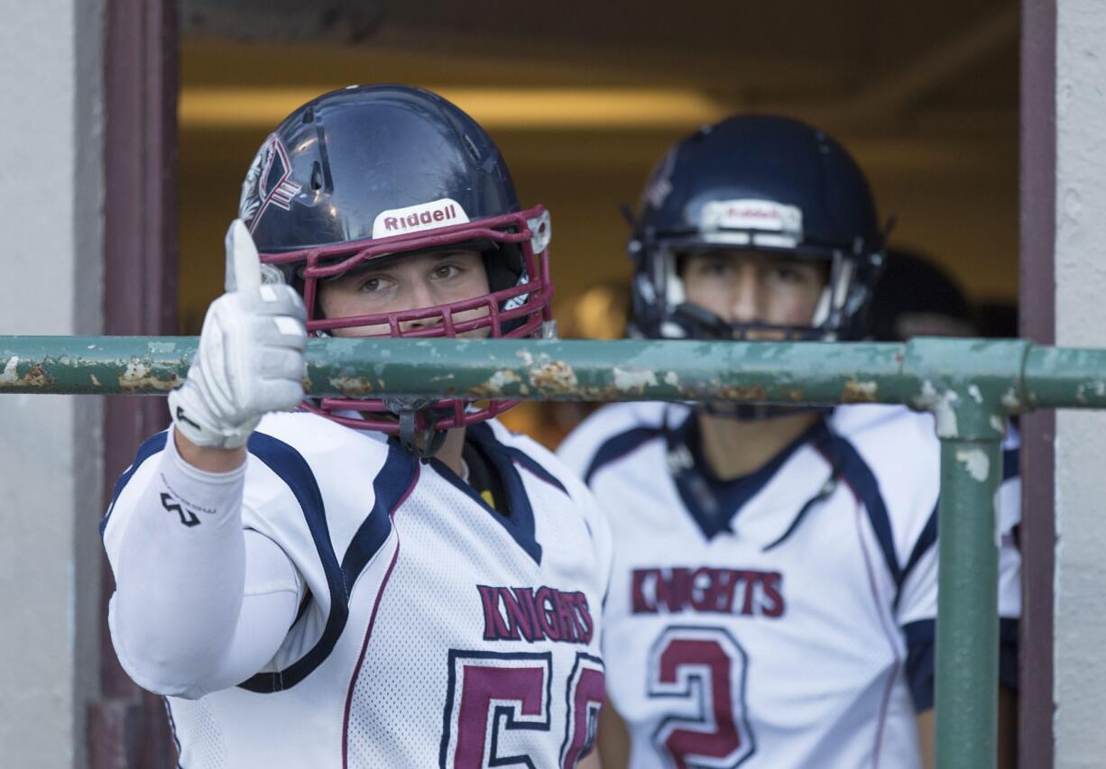 King's Way offensive lineman Riley Danberg (50) gives a thumbs-up to his coach before their football game between Fort Vancouver High School and King's Way Christian High School at the Kiggins Bowl in Vancouver on Thursday, Aug. 31, 2017.