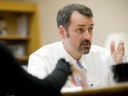 Vancouver City Manager Eric Holmes holds a meeting in 2010 with staff in his office at City Hall.