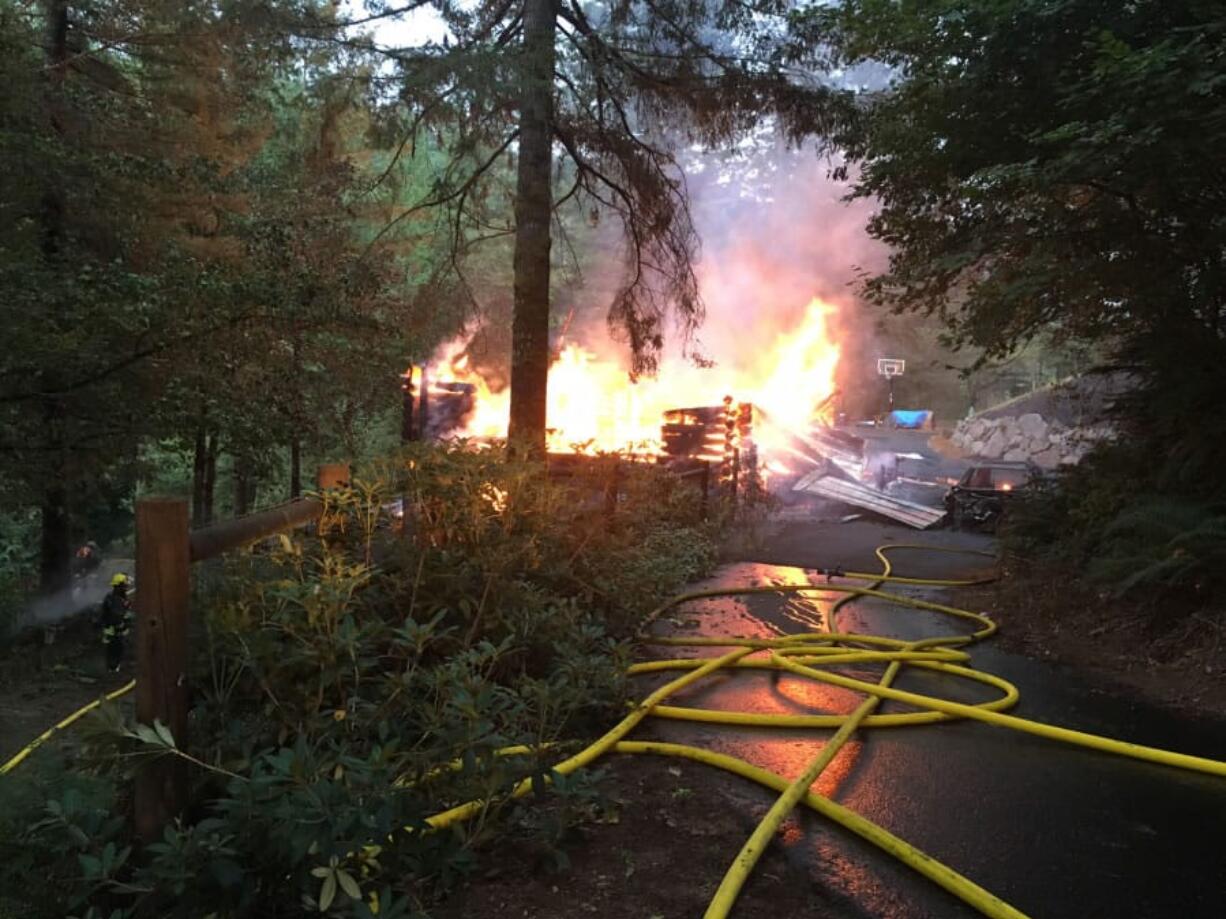 A log cabin on Northeast 375th Avenue in Washougal was completely destroyed by fire on Saturday morning. No one was injured.