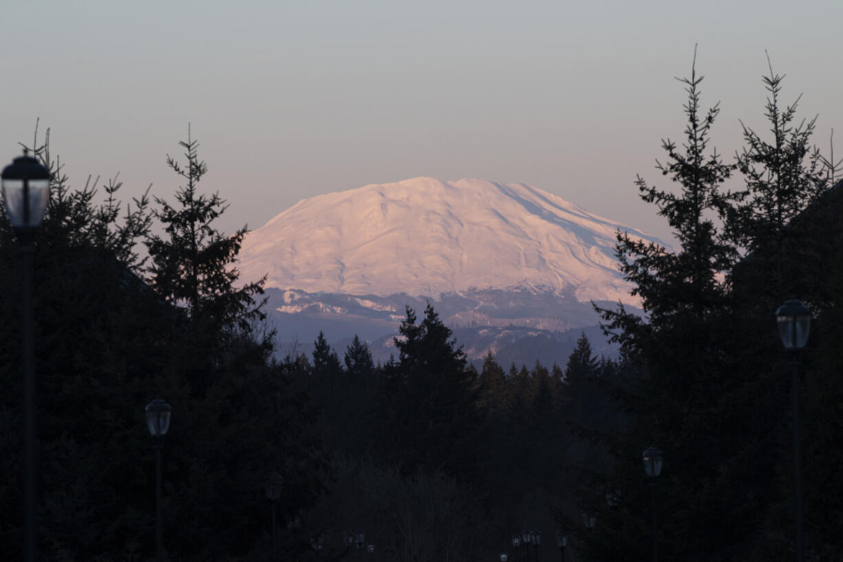 The sun sets over Mount St. Helens as seen from the WSUV campus.