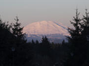 The sun sets over Mount St. Helens as seen from the WSUV campus.