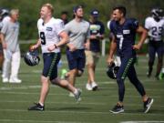 Seattle Seahawks punter Jon Ryan (9) and kicker Blair Walsh (7) take to the field for NFL football training camp, Thursday, Aug. 3, 2017, in Renton, Wash.