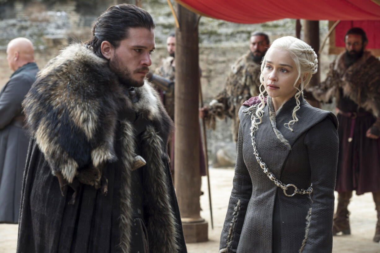 This image released by HBO shows Kit Harington, left, and Emilia Clarke on the season finale of "Game of Thrones." The series set yet another audience record Sunday with its seventh-season finale. Nielsen says an all-time high of 12.1 million viewers were tuned in to the wildly popular fantasy drama. An additional 4 million caught the episode on streaming channels. (Macall B.