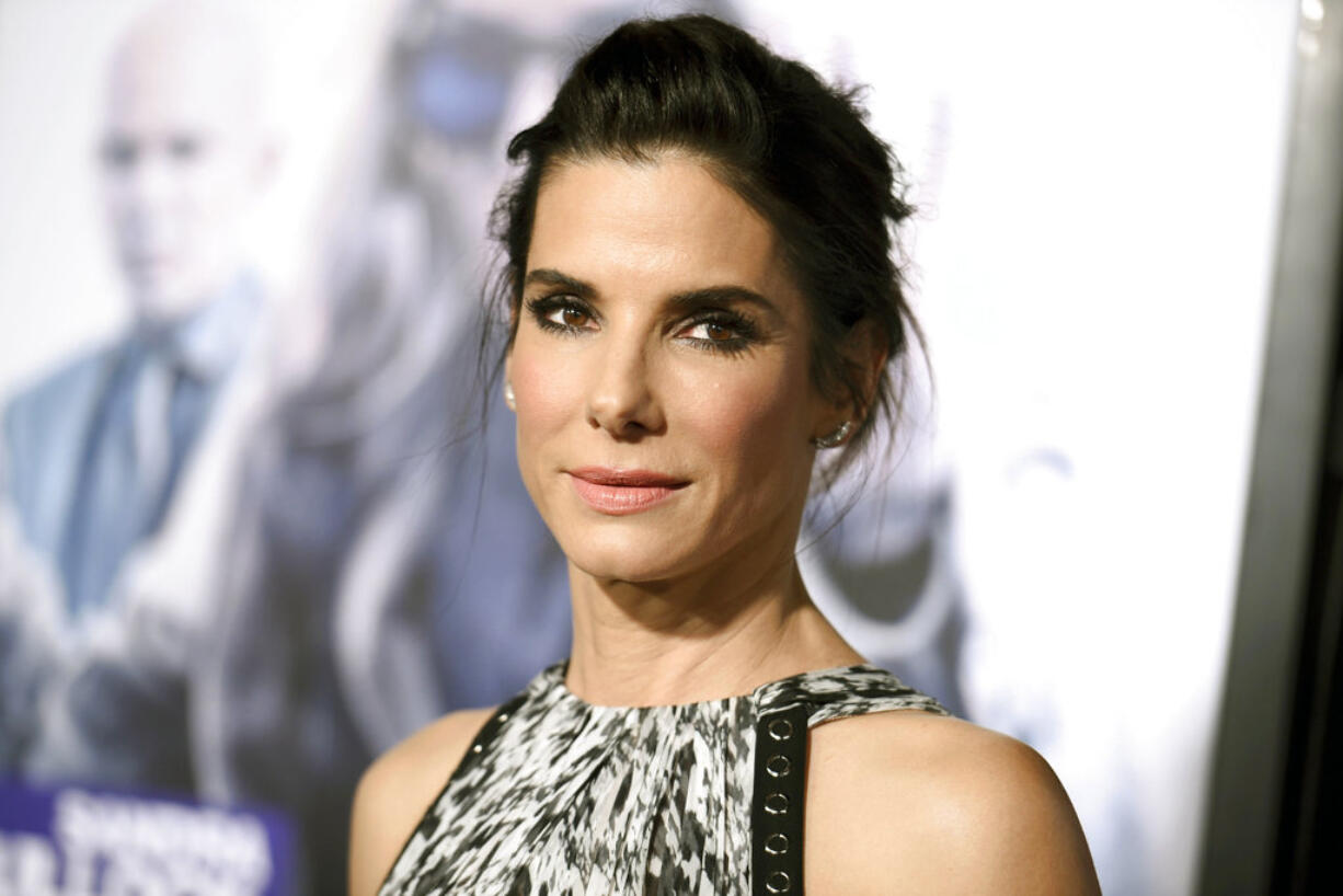 FILE - This Oct. 26, 2015 file photo shows actress Sandra Bullock arrives at the premiere of "Our Brand is Crisis" in Los Angeles. A pair of Oscar winners, Bullock and Leonardo DiCaprio, are leading the way in stars’ donations to relief efforts for those affected by Hurricane Harvey in Texas and Louisiana, but numerous others have pledged sizable amounts to charities.