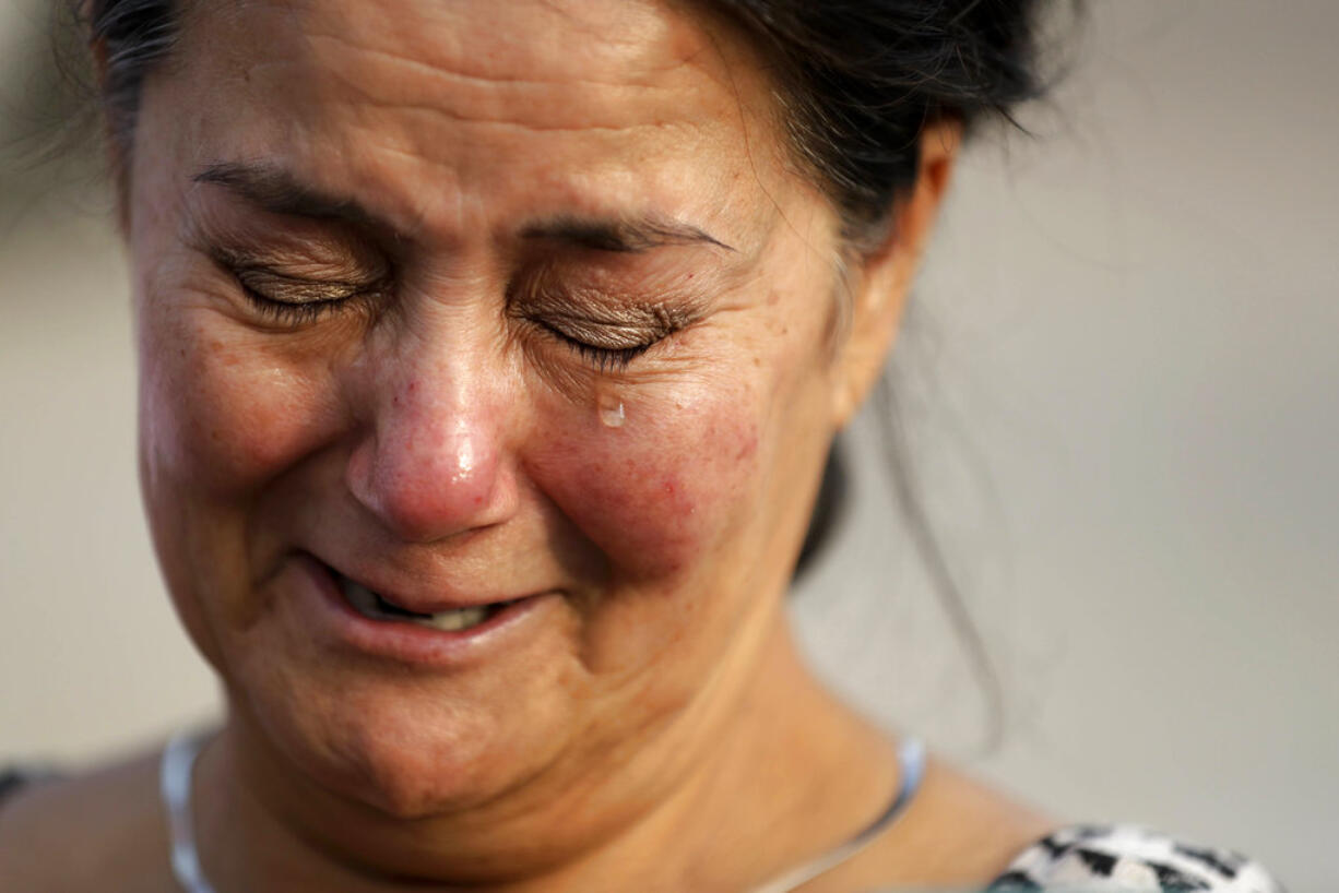 Frances Breaux cries as she talks about her fears for two close friends who live near the Arkema Inc. chemical plant Thursday, Aug. 31, 2017, in Crosby, Texas. Breaux said her close friends, an elderly couple that live close to the plant, have not been heard from Thursday. The Houston-area chemical plant that lost power after Harvey engulfed the area in extensive floods was rocked by multiple explosions early Thursday, the plant's operator said.