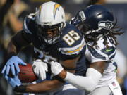 The Chargers’ Antonio Gates (85) hauls in a TD pass as Seahawks defensive back Shaquill Griffin (26) defends. Mark J.