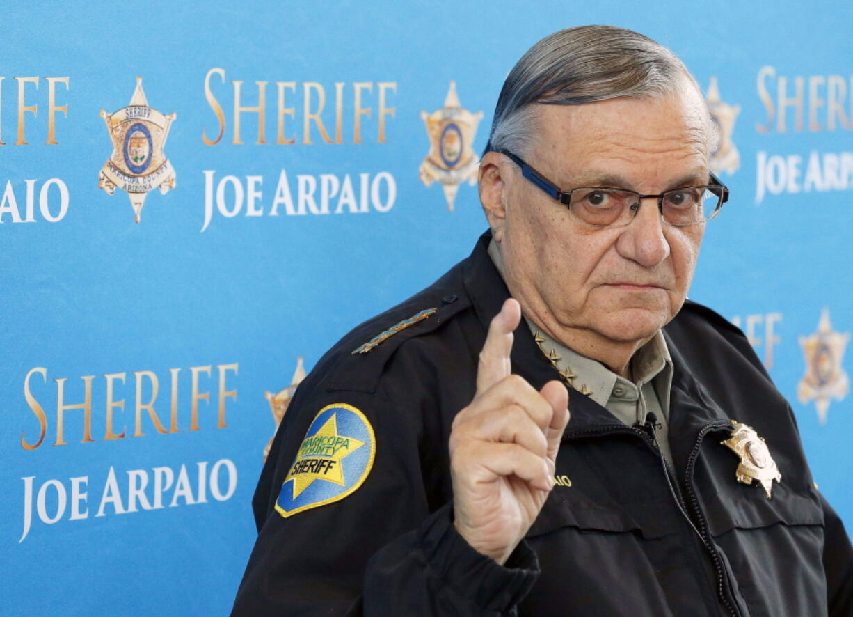 In this Dec. 18, 2013, file photo, Maricopa County Sheriff Joe Arpaio speaks at a news conference at the Sheriff’s headquarters in Phoenix, Ariz. President Donald Trump has pardoned former sheriff Joe Arpaio following his conviction for intentionally disobeying a judge’s order in an immigration case. The White House announced the move Friday night, Aug. 25, 2017, saying the 85-year-old ex-sheriff of Arizona’s Maricopa County was a “worthy candidate” for a presidential pardon.