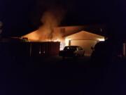 Fire burns a house at 806 N.W. 16th Ave. in Battle Ground early Sunday morning.