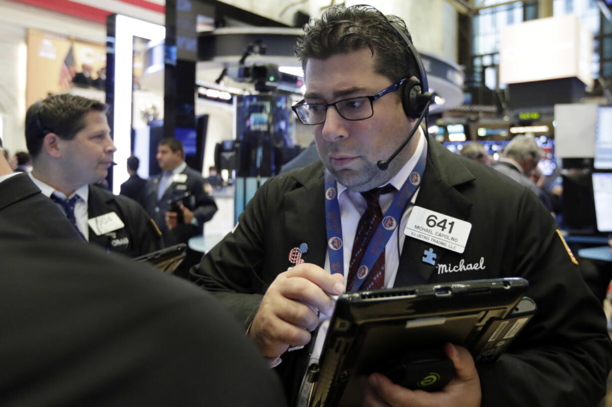 Trader Michael Capolino works on the floor of the New York Stock Exchange, Wednesday, Aug. 16, 2017. Stocks are opening higher on Wall Street following some encouraging results from retailers.