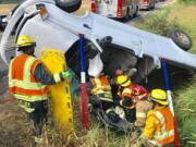 Crews worked for about 15 minutes to extricate a woman inside a pickup that was injured in a two-vehicle crash  at Northeast 72nd Avenue and Northeast 199th Street Wednesday morning.