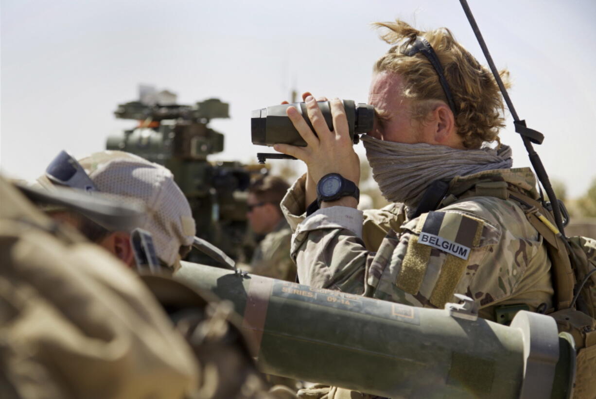 A Belgian special forces soldiers looks through his binoculars near the frontline, east of Tal Afar, Iraq, on Sunday. Iraqi forces have launched a multi-pronged assault to retake the town of Tal Afar, west of Mosul, marking the next phase in the country’s war on the Islamic State group. Tal Afar and the surrounding area is one of the last pockets of IS-held territory in Iraq after victory was declared in July in Mosul, the country’s second-largest city.