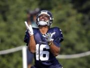 Seattle Seahawks wide receiver Tyler Lockett reaches to catch a ball during NFL football training camp in Friday, Aug. 4, 2017, in Renton, Wash.