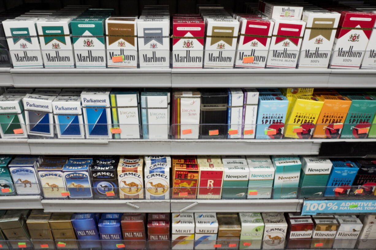 Cigarettes are displayed on a shelf, Monday, Aug. 28, 2017, in New York. Mayor Bill de Blasio is expected to sign legislation raising the legal minimum price for a pack of cigarettes to $13. The hike from $10.50 further cements the city’s claim on having among the most expensive cigarettes in the country.