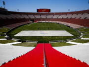 Los Angeles Memorial Coliseum, the venue proposed for Olympic opening and closing ceremonies and track and field events. stands in Los Angeles. The Los Angeles City Council is expected Friday, Aug. 11, 2017 to endorse a proposal to host the 2028 Olympics, following an announcement of a deal last month to leave 2024 to Paris. (AP Photo/Jae C.